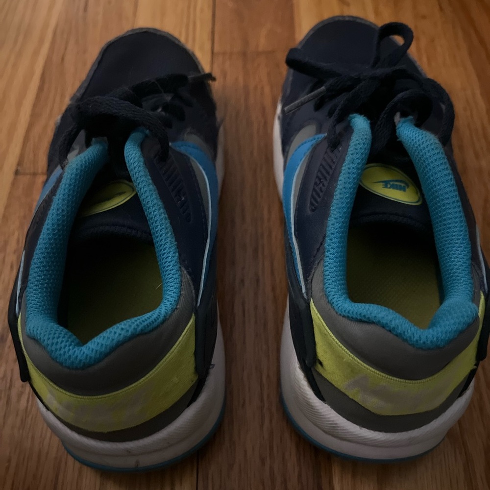 Nike kids 4.5y navy with  blue and neon yellow accents sneakers.